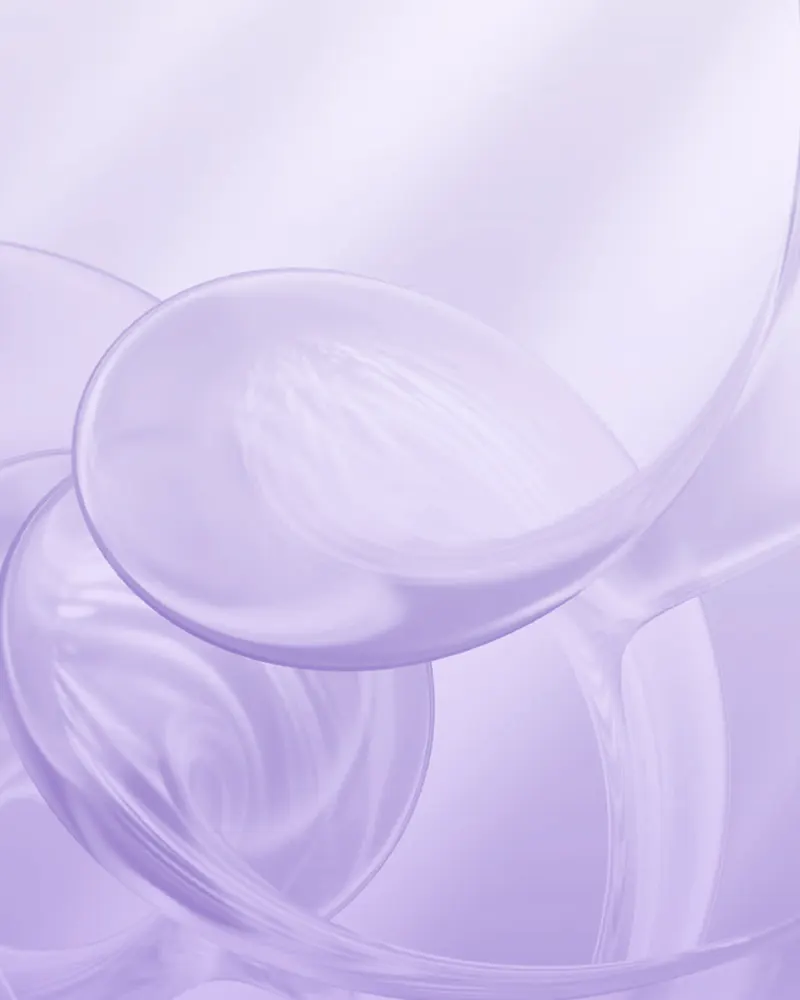 Soft curves of pale violet glass.